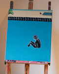 Painting of a person sitting on a blue background on an easel.
