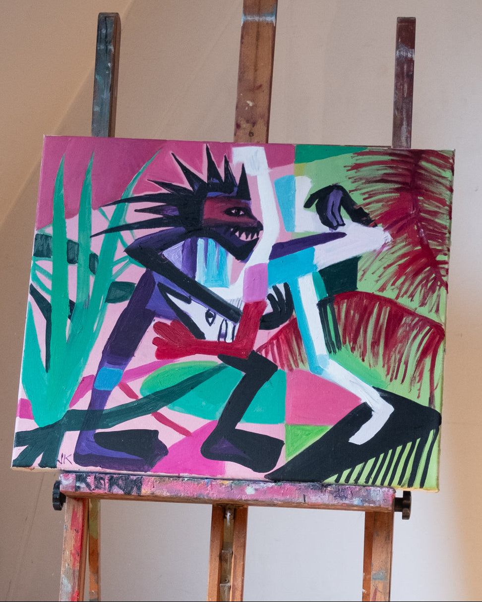 Abstract painting on an easel with vibrant colors and dynamic figures.