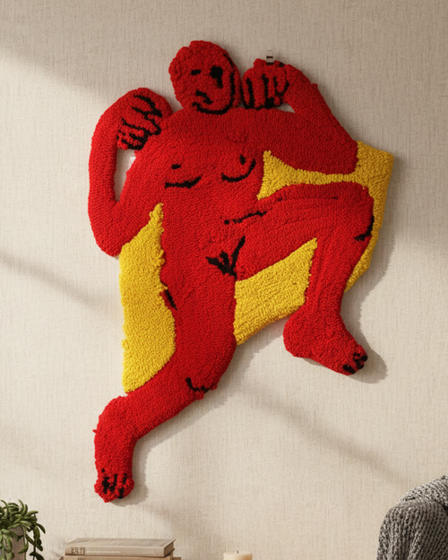 Decorative wall art of a red and yellow monkey on a neutral wall.