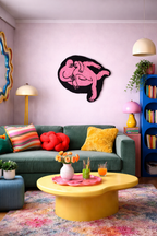 Colorful living room with a green sofa, yellow coffee table, and decorative elements.